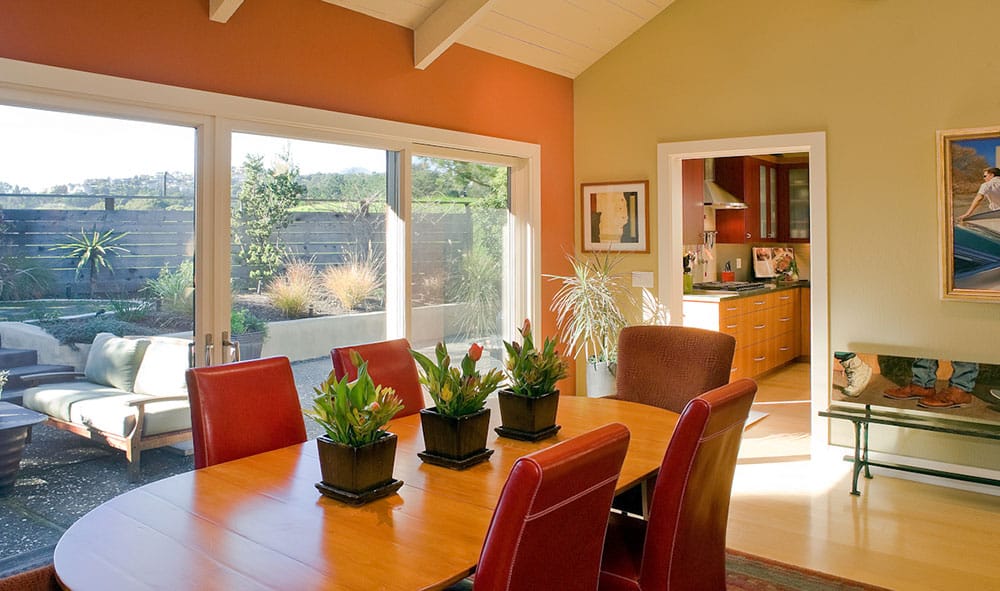 5-the-newly-remodeled-dining-room-and-kitchen-relate-in-color-style-and