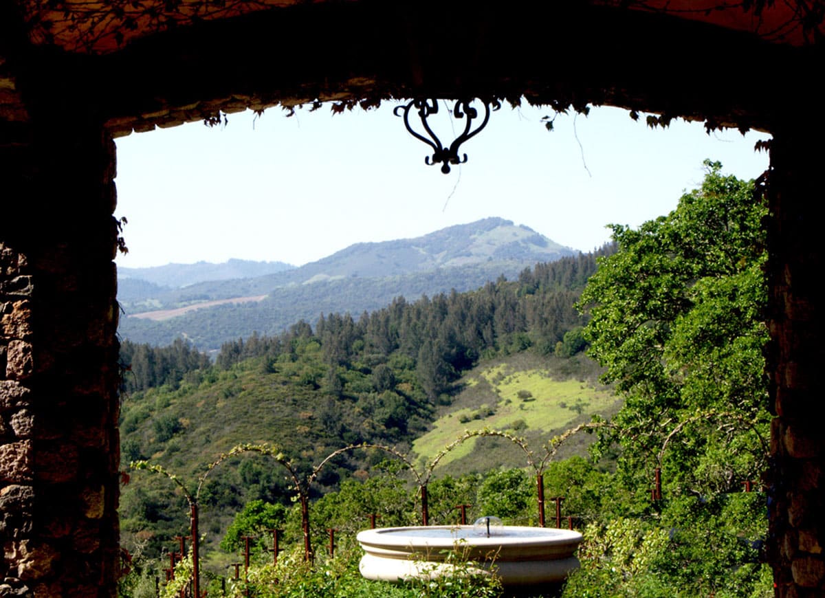 A fountain defines the middle of a circular driveway overlooking Sonoma Valley.