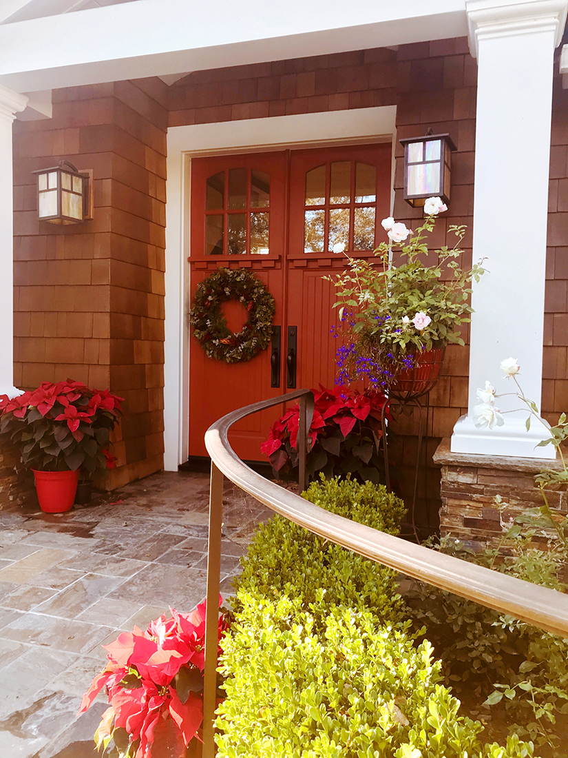 Two huge red poinsettias flanked the doorway.