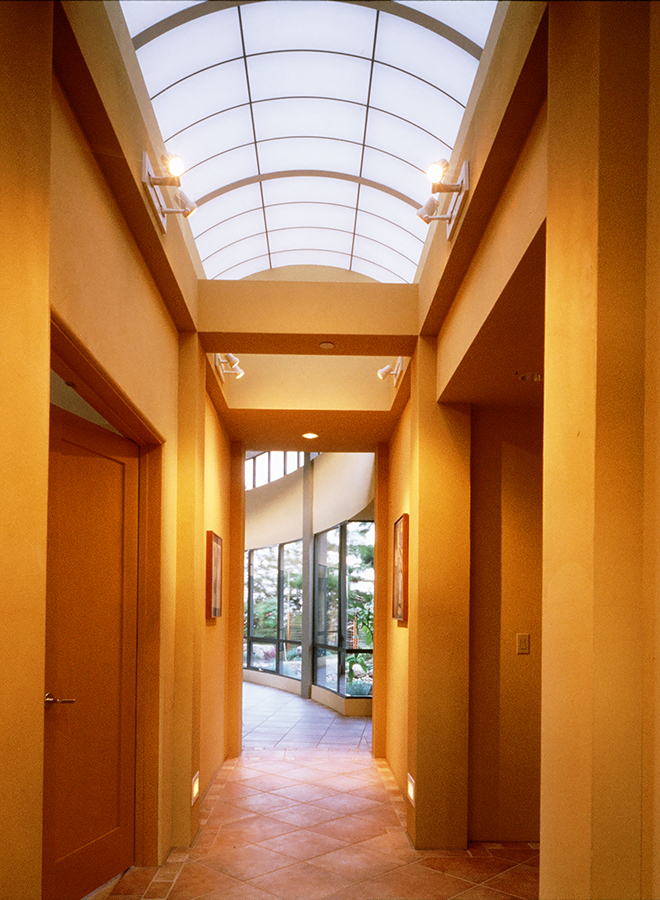 An arched skylight fills this hallway with the sun's toasty warmth