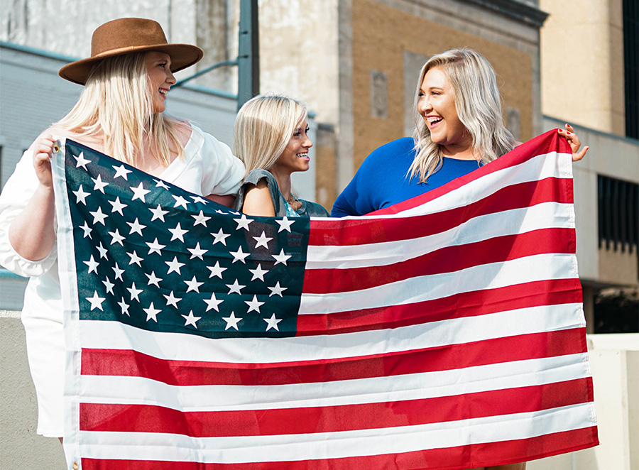 image of women holding the flag