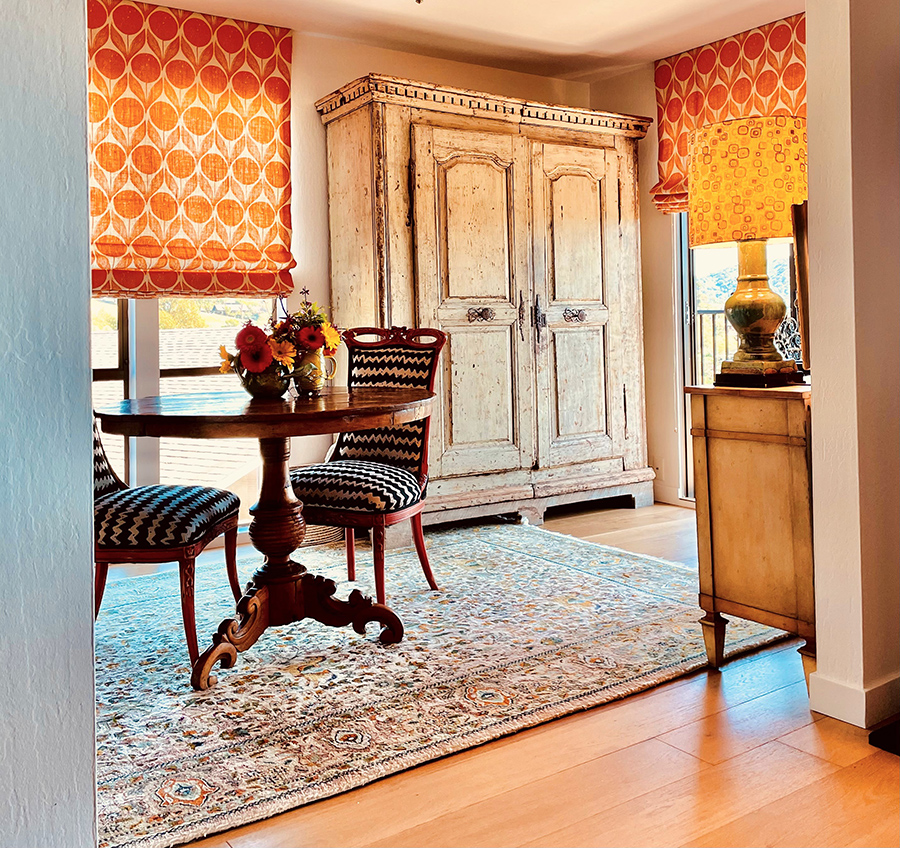 The image that is for The 6-foot wide by 7-foot tall armoire makes the tiny space feel substantial.