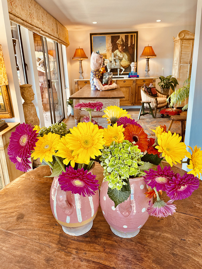 Image of the wide opening into the living room that makes the compact room feel large.