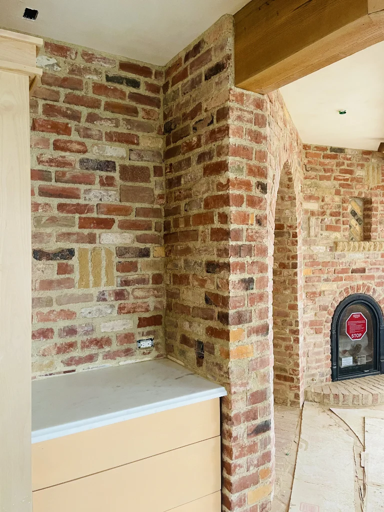 Colorful brick arch and fireplace